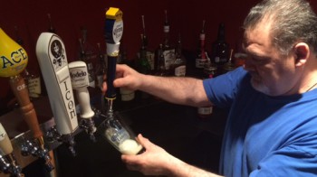 Man pouring draft beer