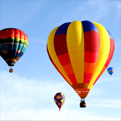 Picture of hot air balloons floating up to the sky