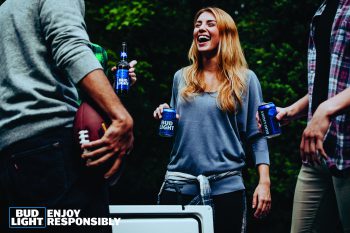 Friends drinking Bud light at a football party